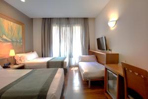 habitación triple - Hotel Catalonia Excelsior