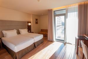 habitación doble con cama supletoria - 2 camas - Hotel Eurostars Oporto