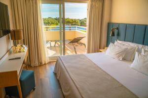 suite con balcón - Onyria Quinta da Marinha Hotel