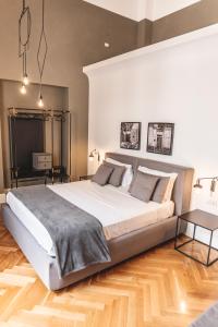 habitación deluxe con cama extragrande - Hotel Relais Della Porta