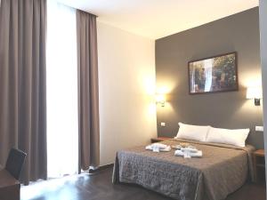 Habitación Triple con baño privado - Rome Travellers Hotel