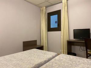 habitación doble económica interior - Somriu Hotel City M28