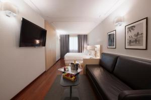habitación cuádruple deluxe - Suites Plaza Hotel & Wellness