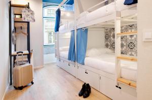 cama en habitación femenina compartida de 4 camas - Hotel The Central House Lisbon Baixa