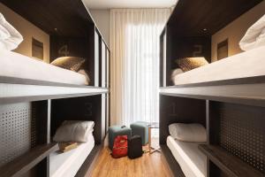 cama en habitación compartida femenina de 6 camas - TOC Hostel Malaga