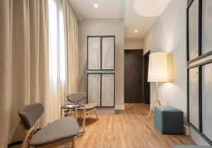 habitación cuádruple con baño privado - TOC Hostel Malaga